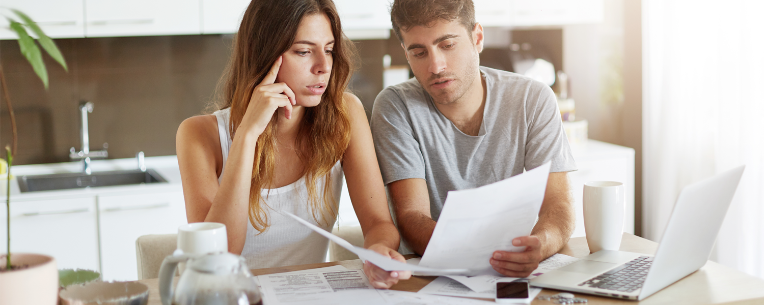 Man and woman looking at paperwork together