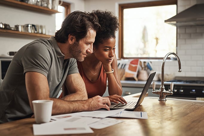 Couple looking at laptop