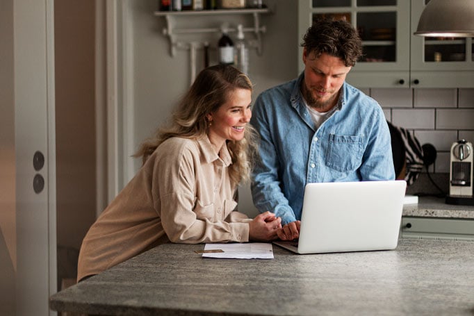 Couple using laptop