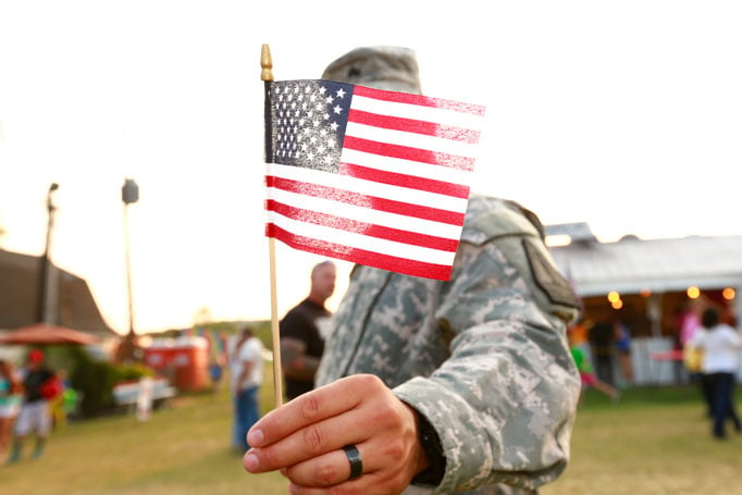 Soldier holding American flag