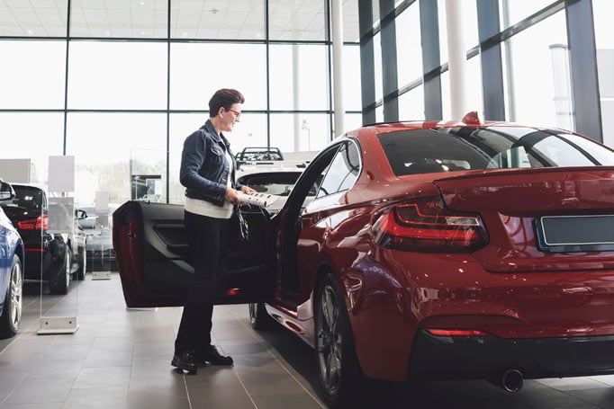 Person looking at car