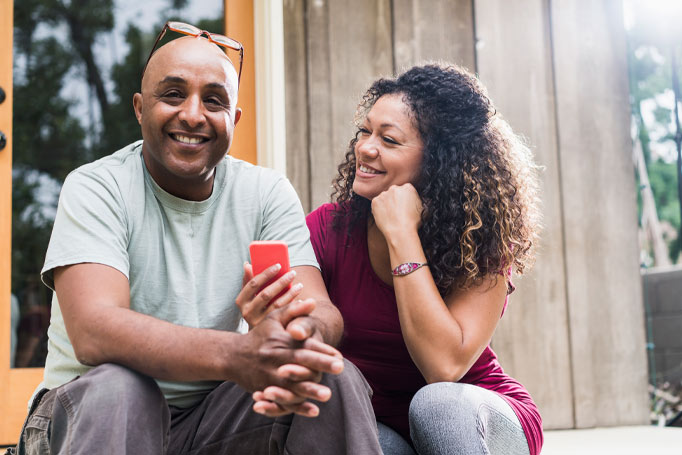 man and woman sitting together