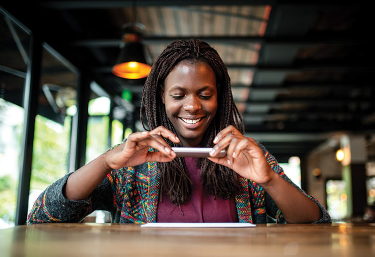 Woman taking a picture of document