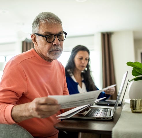 Man and woman looking at documents